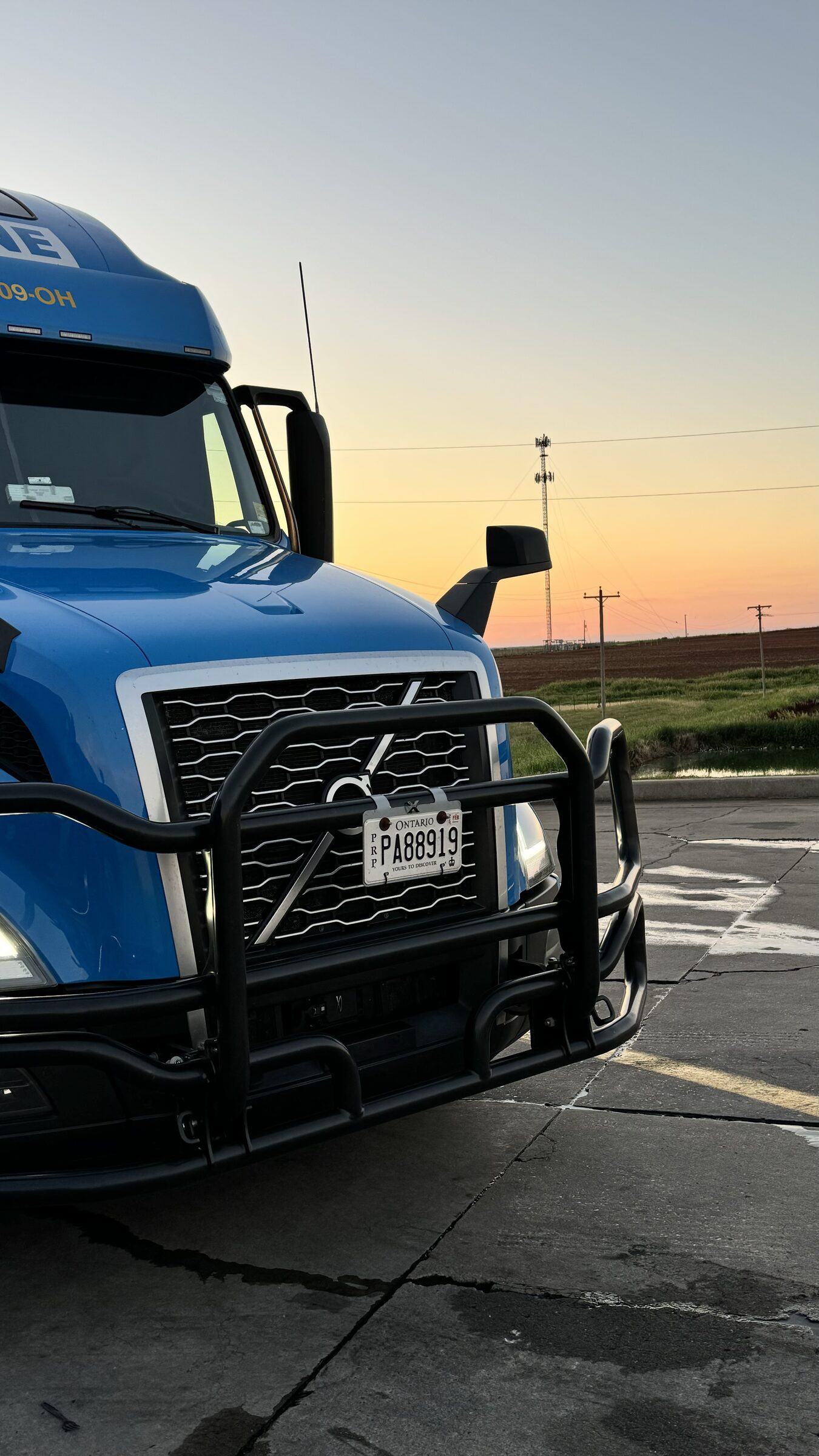 Blue Caravan cab parked at twilight under deep blue evening sky
